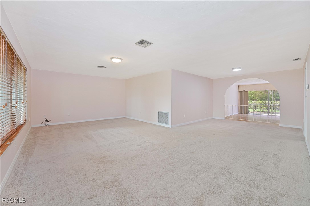 4255 Glasgow Court North Fort Myers, FL 33903 - Photo 5 of 35 a view of an empty room with a window
