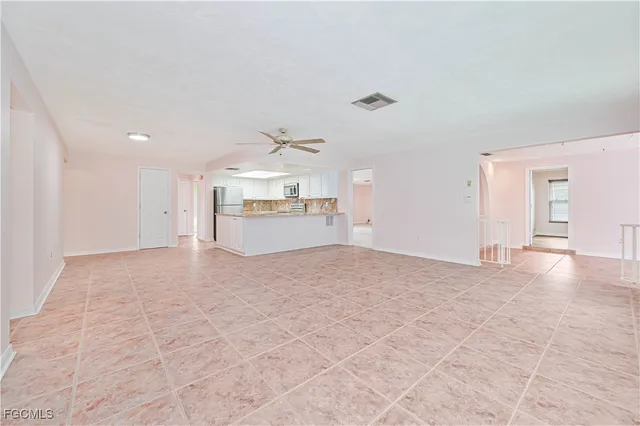 a view of a kitchen with a sink and a stove top oven