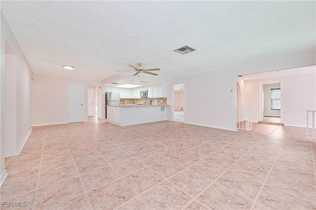 4255 Glasgow Court North Fort Myers, FL 33903 - Photo 7 of 35 a view of a kitchen with a sink and a stove top oven