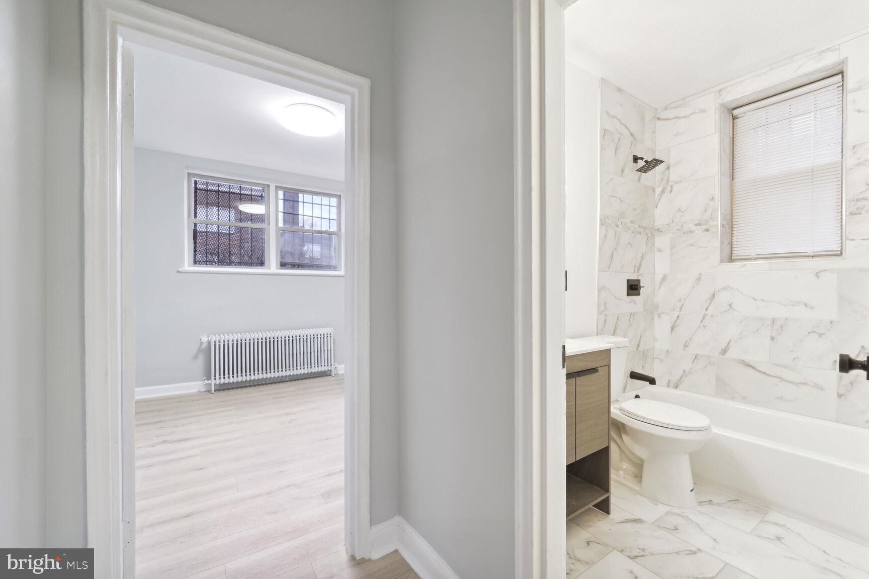 3937 S Street Southeast, Unit 6A Washington, DC 20020 - Photo 12 of 23 a bathroom with a toilet and a shower