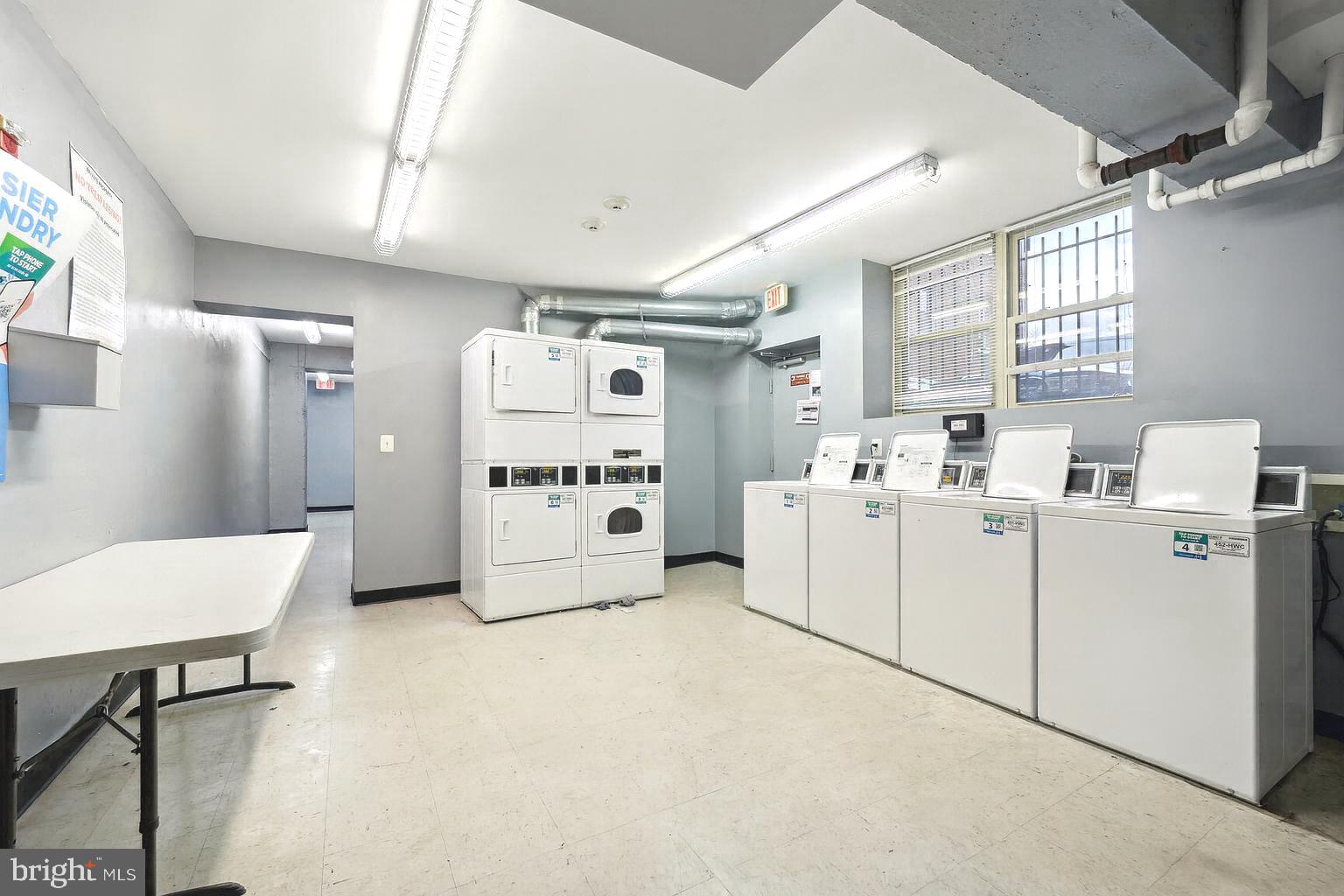 3937 S Street Southeast, Unit 6A Washington, DC 20020 - Photo 15 of 23 a room with white cabinets and white appliances