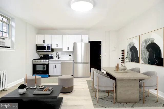 a kitchen with stainless steel appliances kitchen island granite countertop a refrigerator a stove a microwave oven a sink and dishwasher