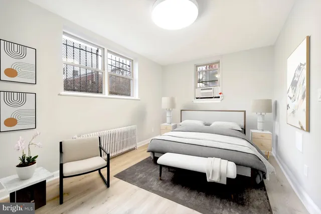 a bed room with a bed and a chair