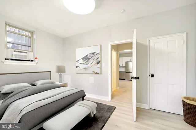 a bedroom with a bed and a couch