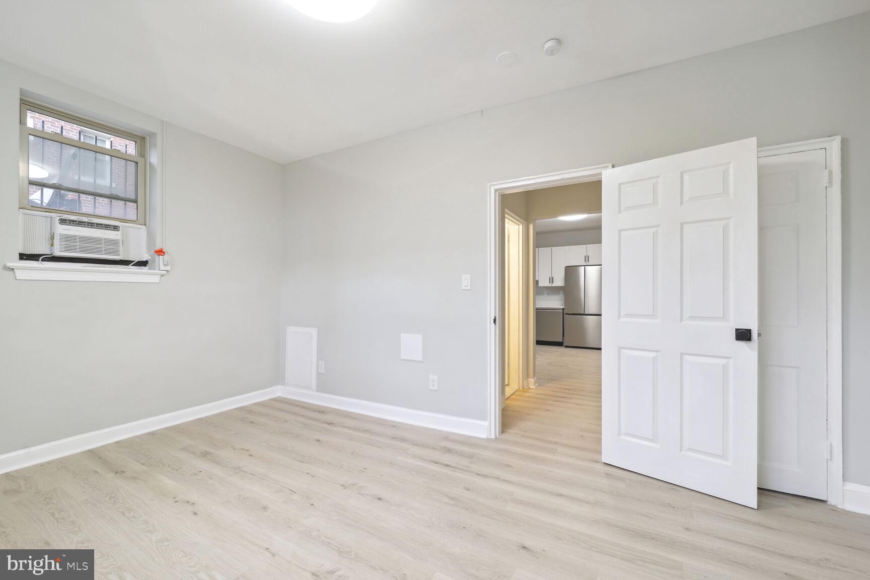 3937 S Street Southeast, Unit 6A Washington, DC 20020 - Photo 9 of 23 a view of an empty room with wooden floor
