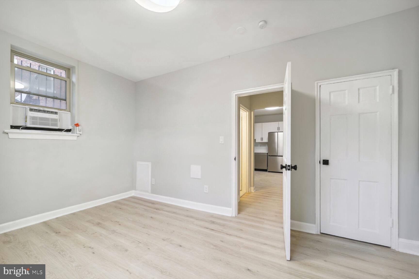 3937 S Street Southeast, Unit 6A Washington, DC 20020 - Photo 10 of 23 wooden floor in an empty room