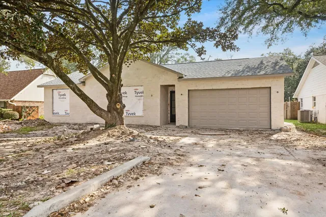 a view of garage yard and tree