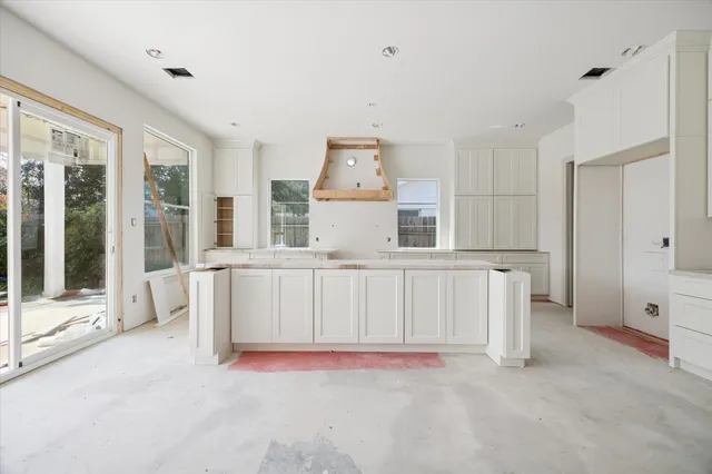 a view of kitchen with furniture and large window