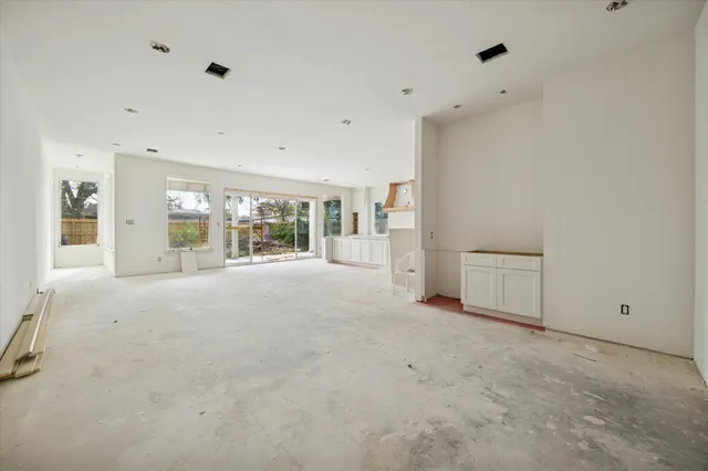 a view of an empty room with a fireplace