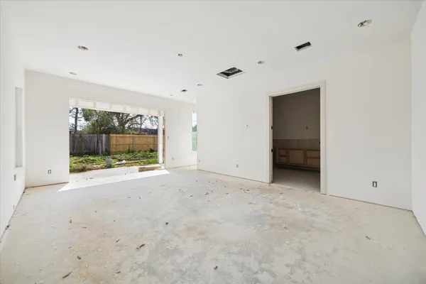 a view of an empty room with a cabinet