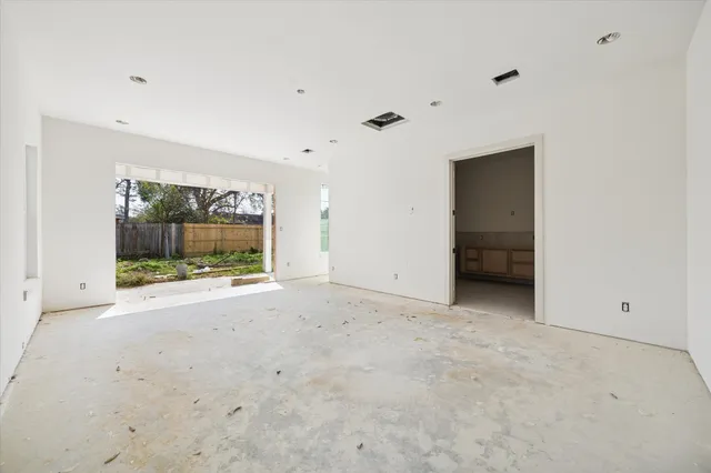 a view of an empty room with a cabinet