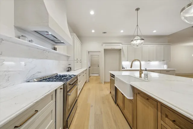 a kitchen with a stove and a sink