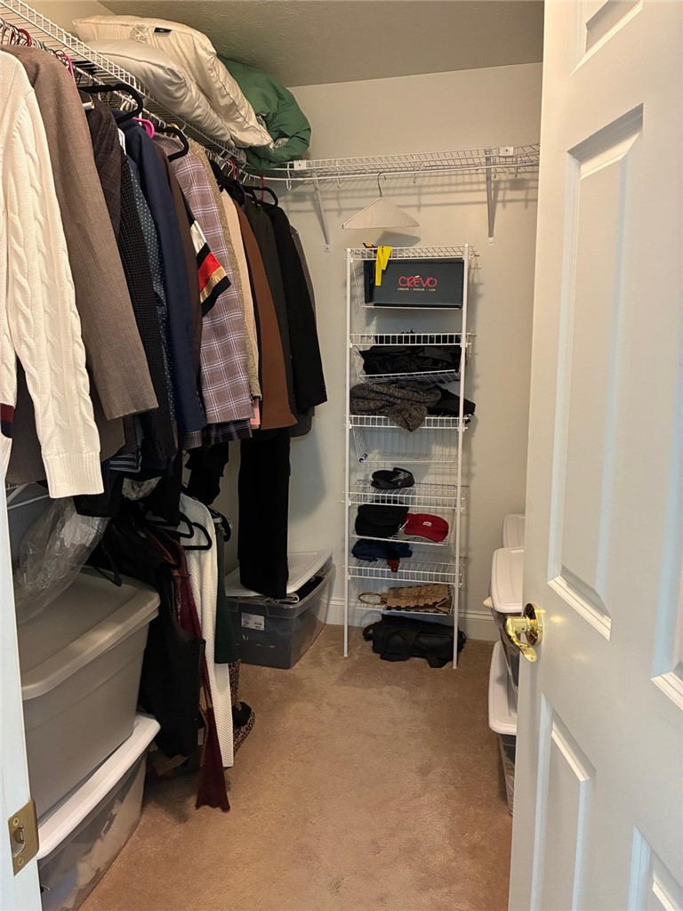 18 Dona Lea Road Perinton, NY 14450 - Photo 18 of 29 The walk-in primary closet offers ample storage.