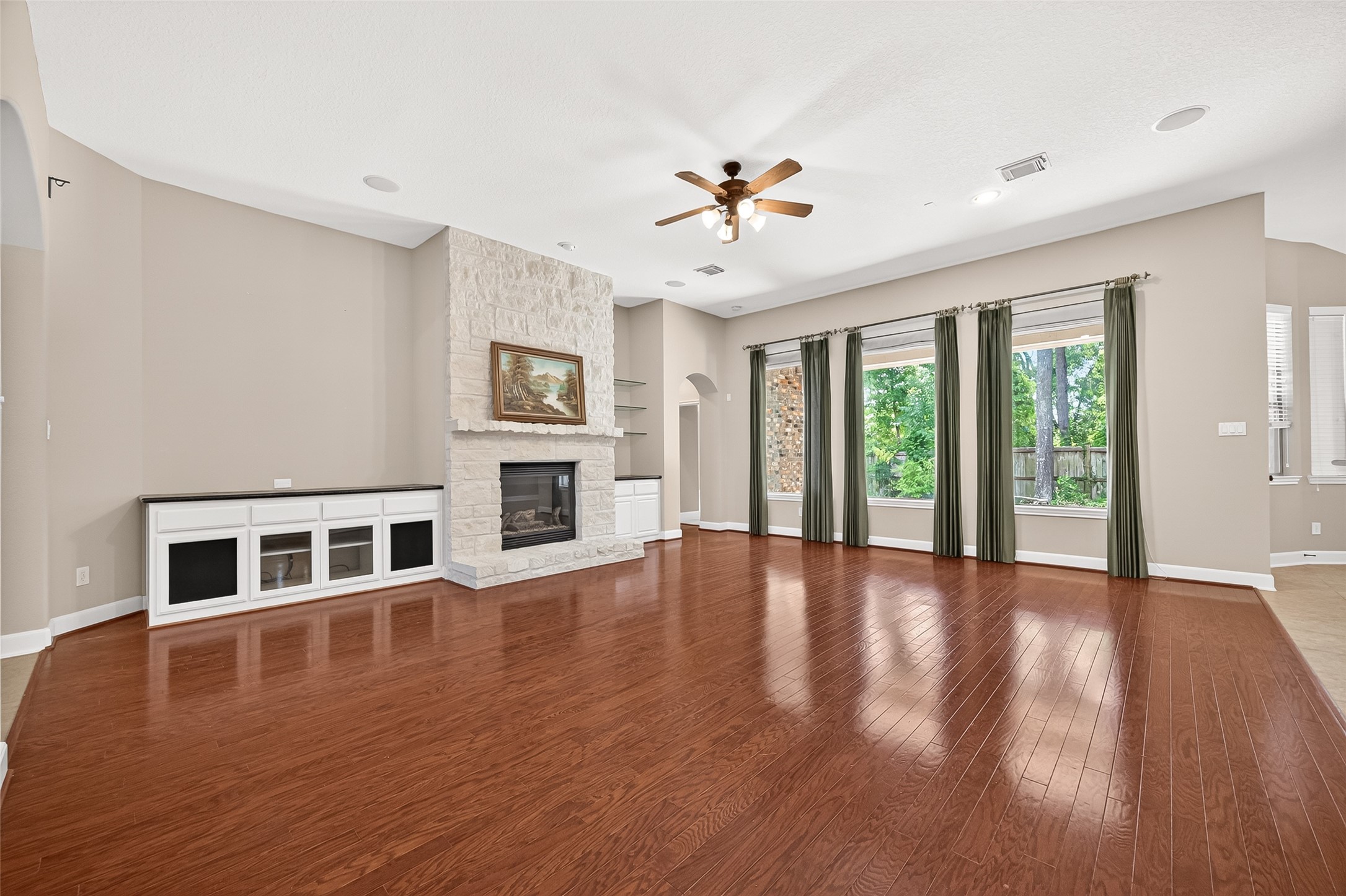 2310 Spring Lake Park Lane Spring, TX 77386 - Photo 11 of 47 a view of an empty room with wooden floor and a window