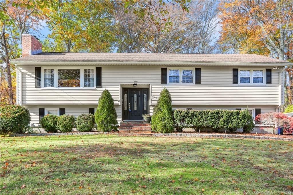 front view of a house with a yard