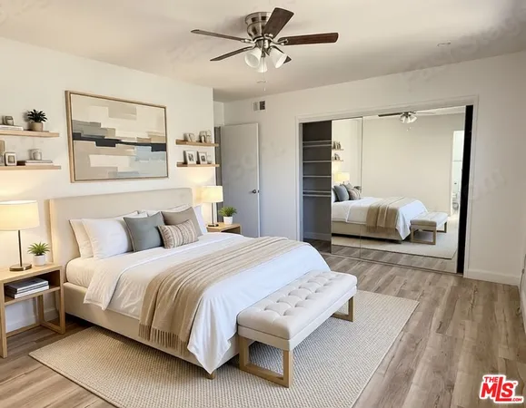 a bedroom with a bed and wooden floor