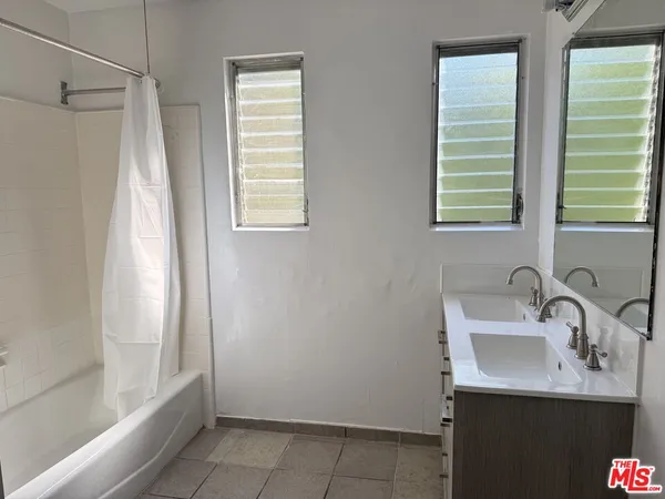 a bathroom with a sink and a bathtub