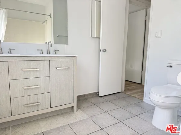 a bathroom with a sink toilet and vanity