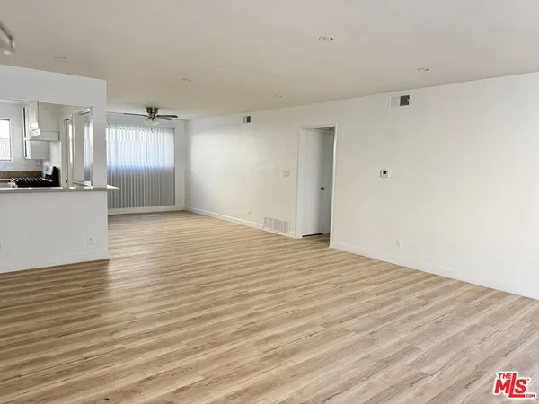 a view of a kitchen counter space and wooden floor