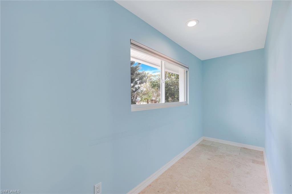 5175 Green Boulevard Naples, FL 34116 - Photo 15 of 43 an empty room with windows
