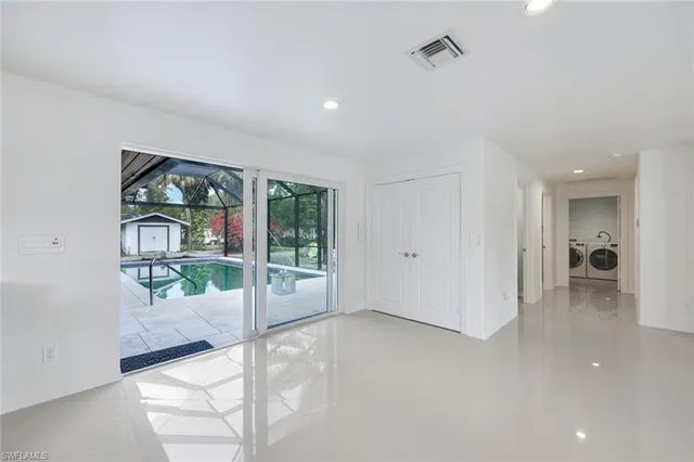 a view of livingroom with furniture and floor to ceiling window