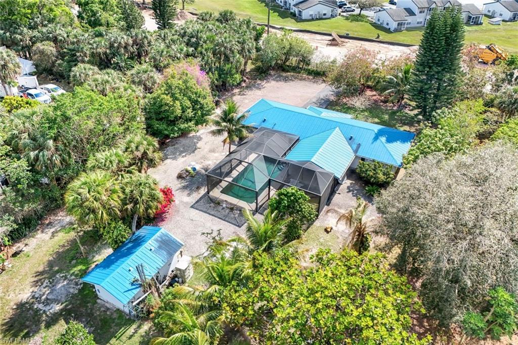 5175 Green Boulevard Naples, FL 34116 - Photo 30 of 43 an aerial view of a house with a yard