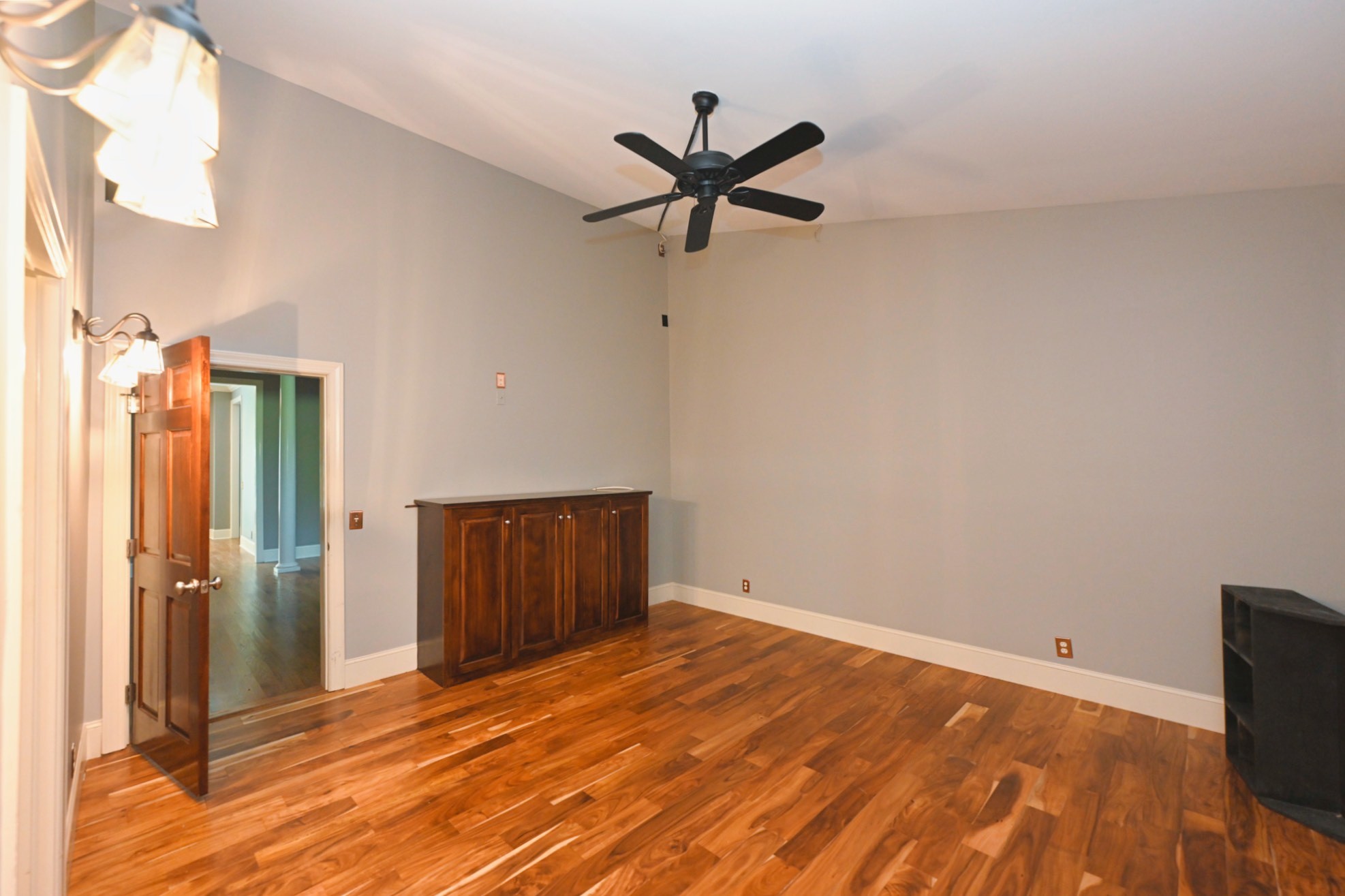 125 Happy Hollow Road Goodlettsville, TN 37072 - Photo 55 of 92 a view of a livingroom with wooden floor and a ceiling fan