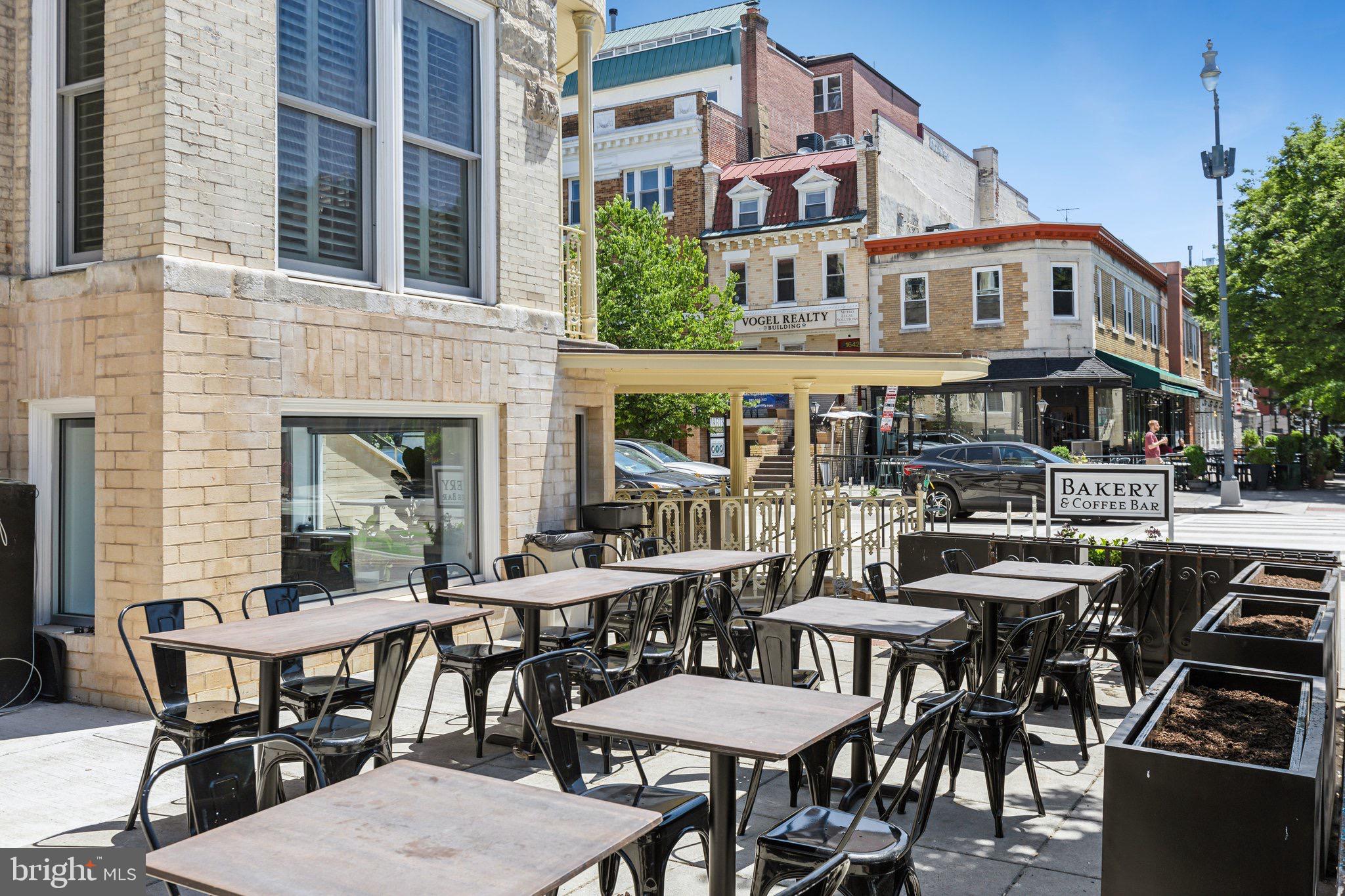 1641 R Street Northwest, Unit 302 Washington, DC 20009 - Photo 15 of 15 a view of a patio with table and chairs and potted plants