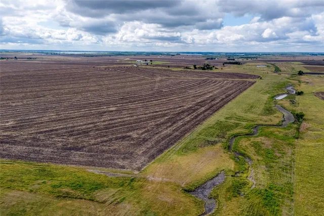 a view of a lake with a building in the background