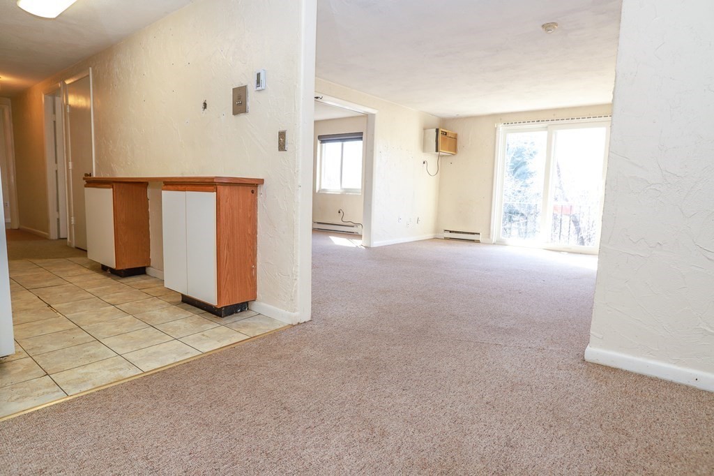 202 Swanson Road, Unit 524 Boxborough, MA 01719 - Photo 11 of 22 a view of an empty room with a window