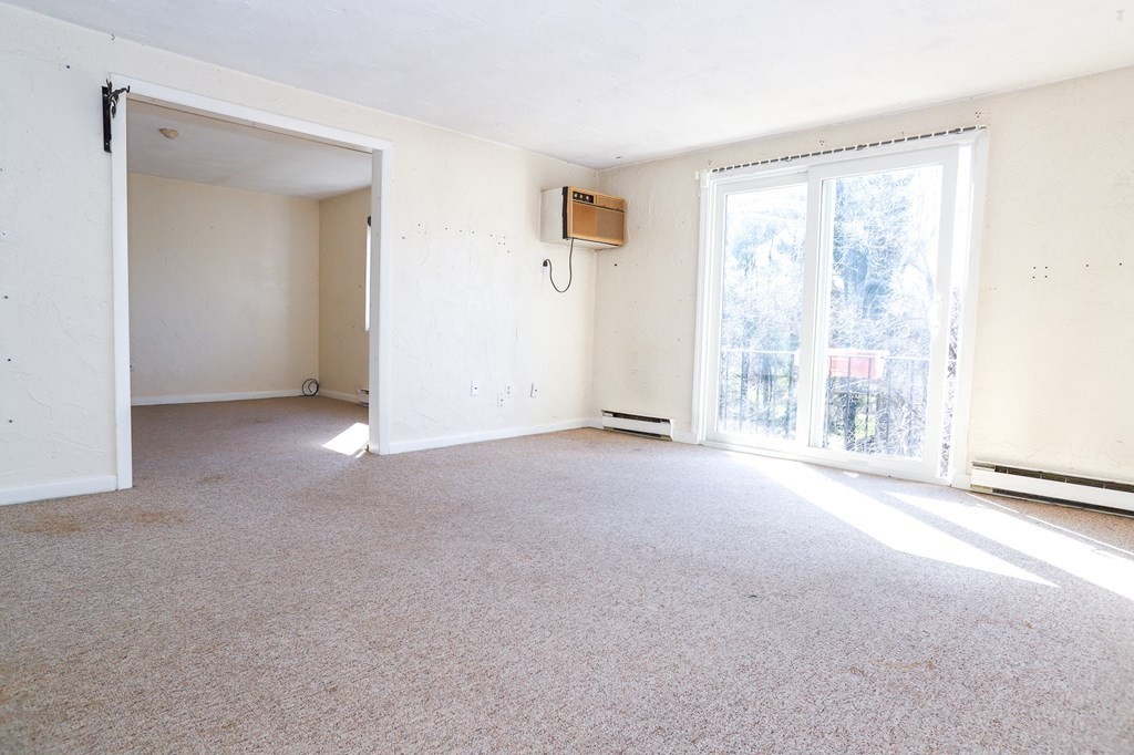 202 Swanson Road, Unit 524 Boxborough, MA 01719 - Photo 12 of 22 a view of an empty room with a window