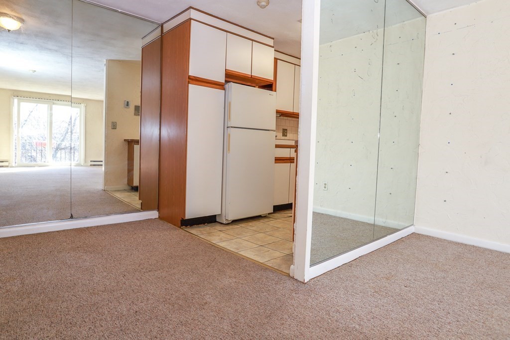 202 Swanson Road, Unit 524 Boxborough, MA 01719 - Photo 3 of 22 an empty room with windows