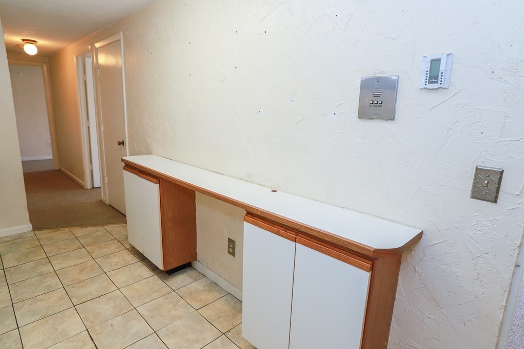 202 Swanson Road, Unit 524 Boxborough, MA 01719 - Photo 7 of 22 a view of a storage & utility room with two washing machine