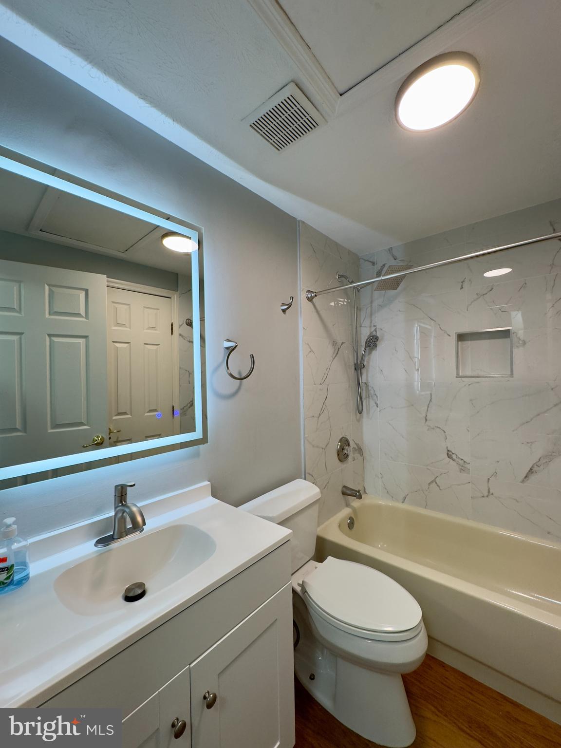 2209 Riding Crop Way Baltimore, MD 21244 - Photo 3 of 20 a bathroom with a sink a toilet and a bathtub