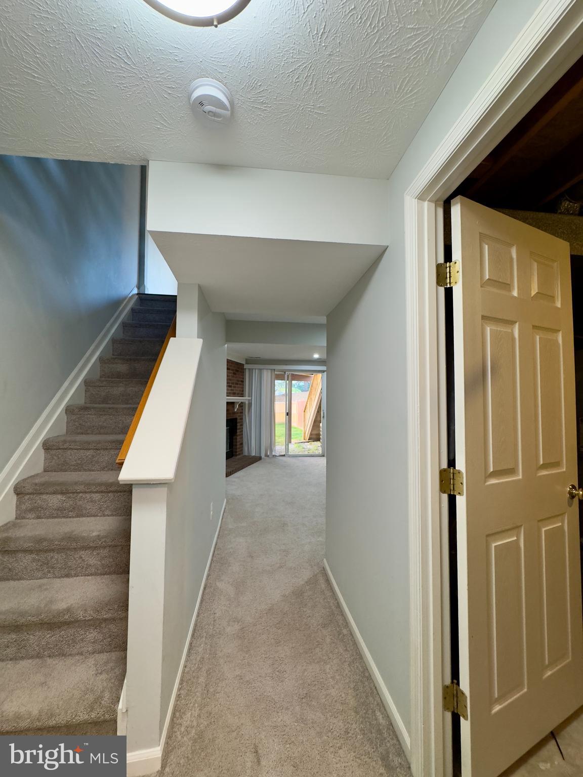 2209 Riding Crop Way Baltimore, MD 21244 - Photo 10 of 20 a view of a hallway with wooden floor and entryway