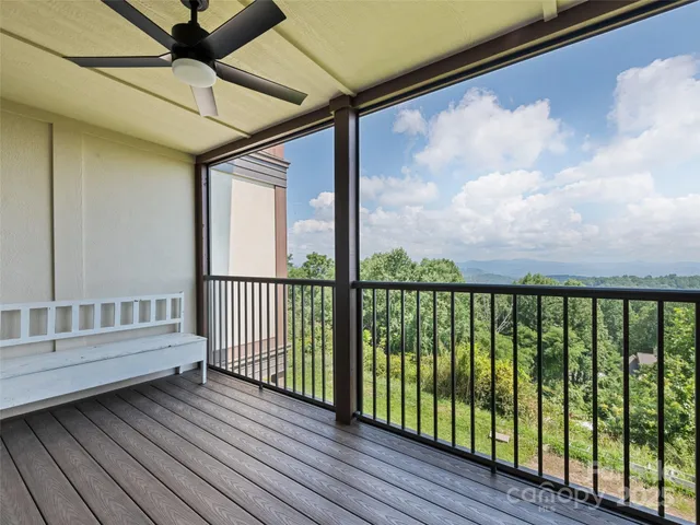 a view of a porch with wooden floor
