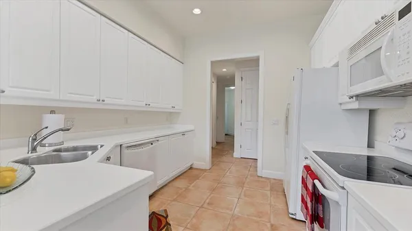 a kitchen that has a sink and a stove