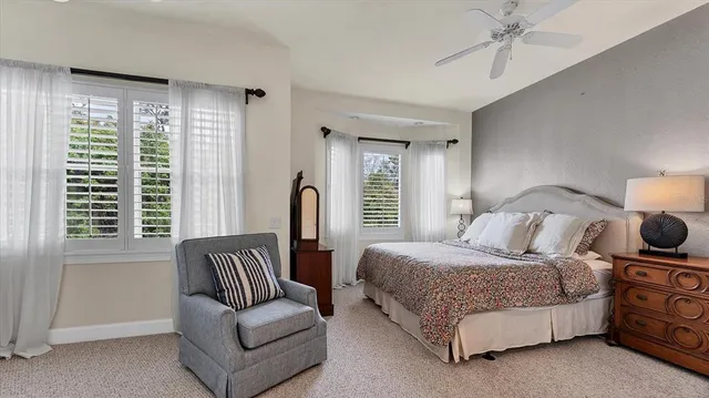 a bedroom with bed and window