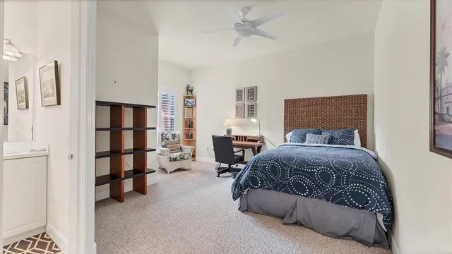 a bedroom with a bed and a book shelf