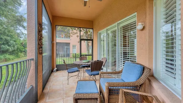 a balcony with chairs and outdoor view