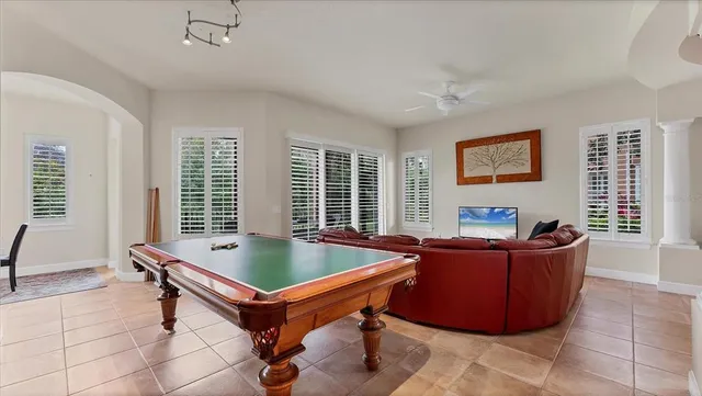 a living room with furniture and windows