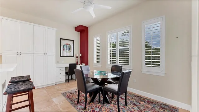 a view of a dining room with furniture and window
