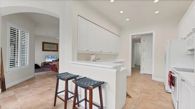 a kitchen with a sink cabinets and appliances