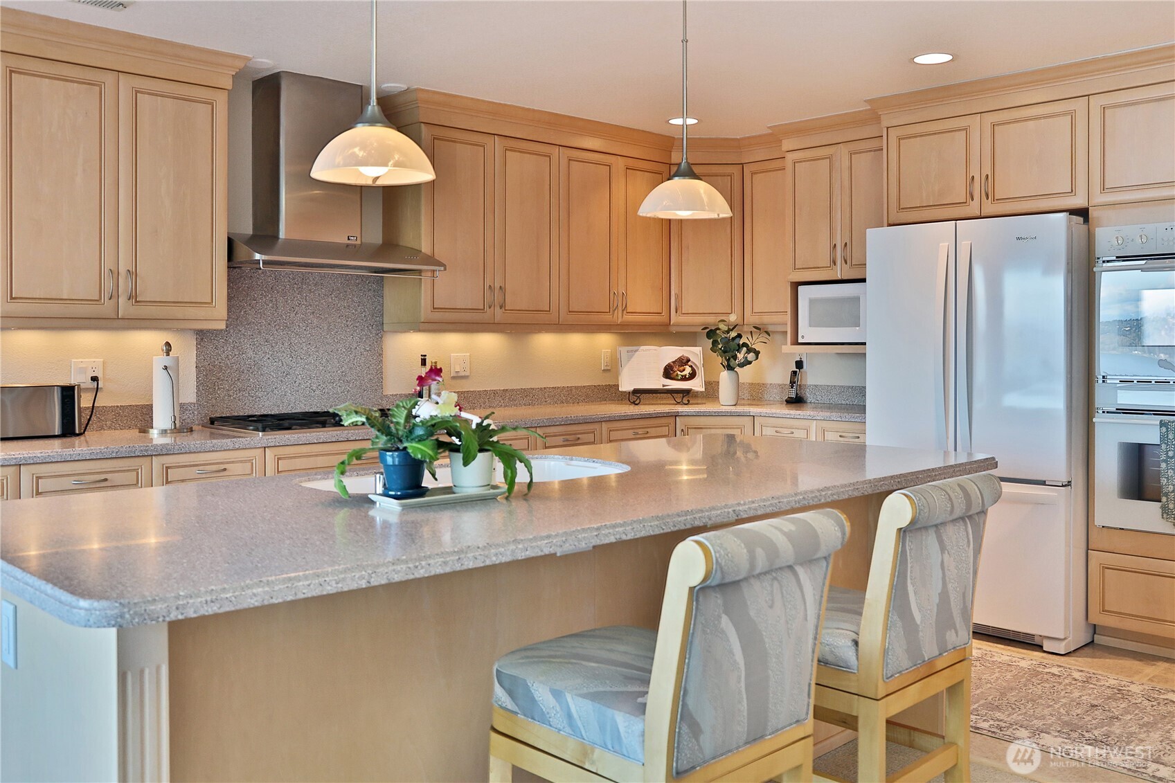 8111 Possession Ridge Lane Clinton, WA 98236 - Photo 23 of 37 a kitchen with stainless steel appliances granite countertop a sink a stove and a refrigerator