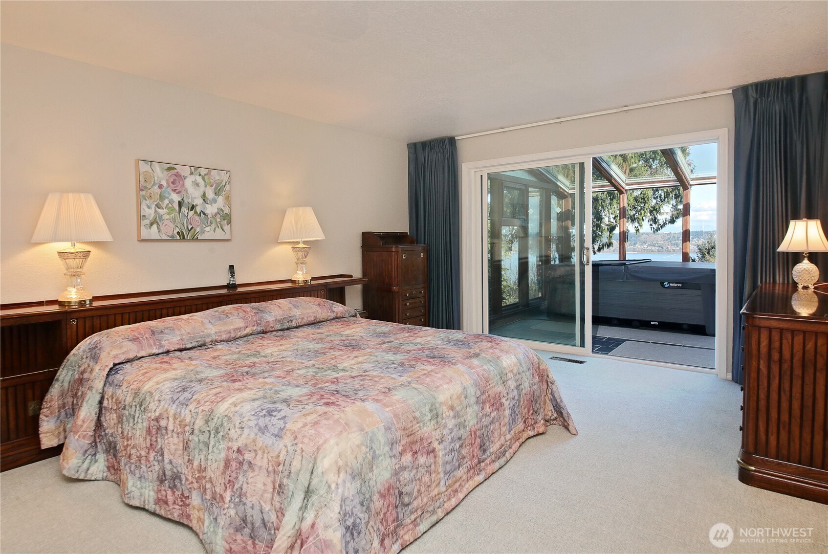 8111 Possession Ridge Lane Clinton, WA 98236 - Photo 25 of 37 a bedroom with a large bed and a large window