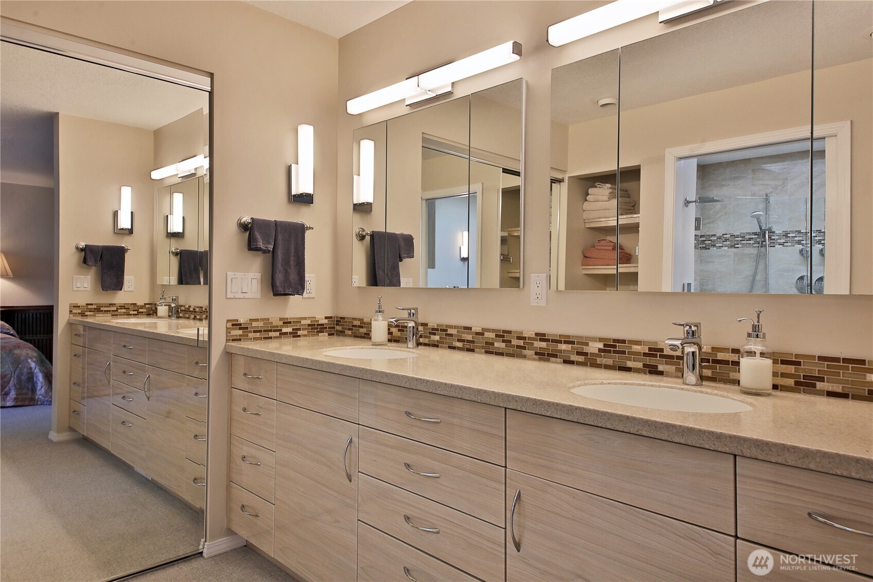 8111 Possession Ridge Lane Clinton, WA 98236 - Photo 26 of 37 a bathroom with a shower sink and mirror