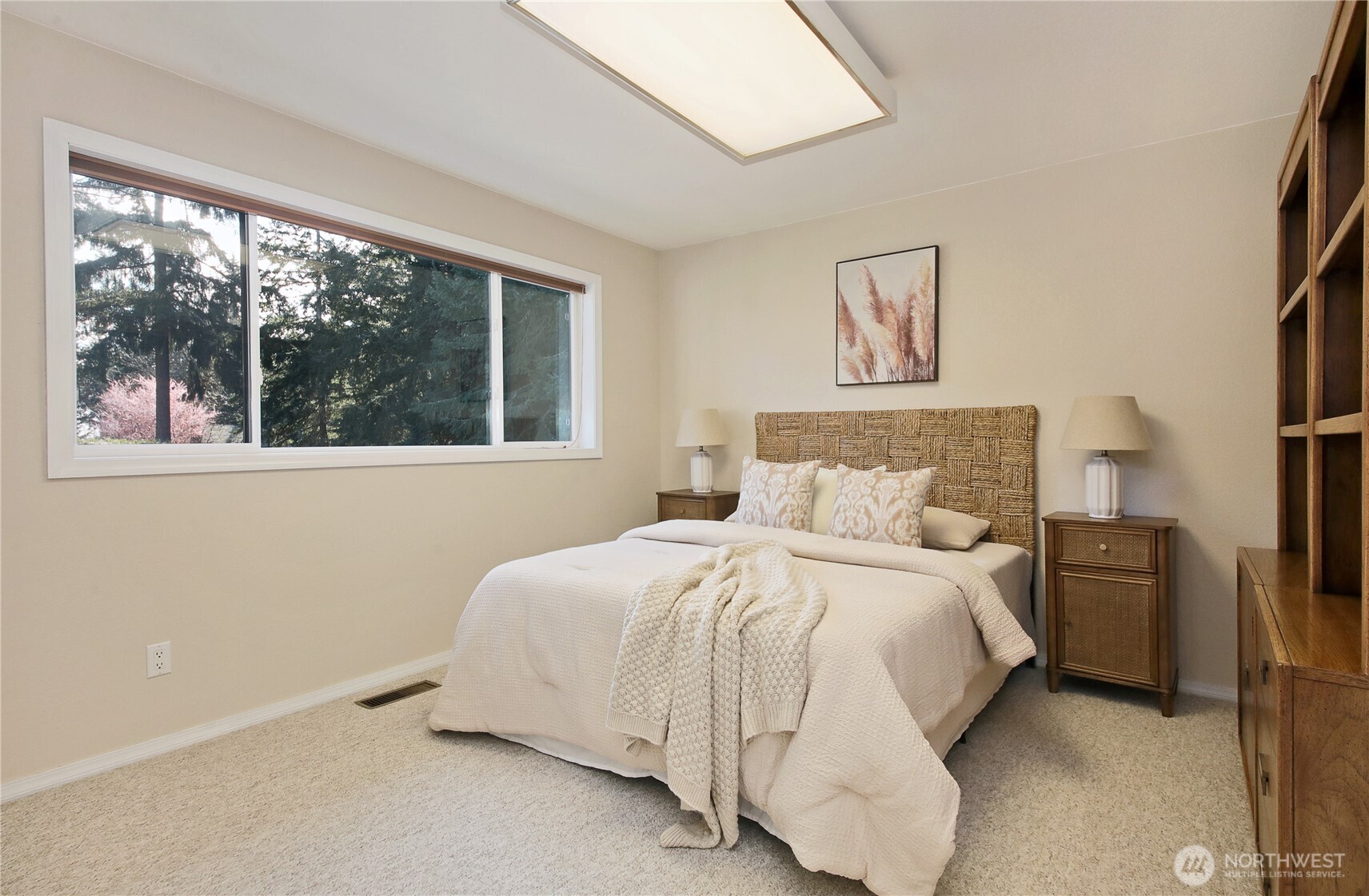 8111 Possession Ridge Lane Clinton, WA 98236 - Photo 31 of 37 a large bed sitting in a bedroom next to a window