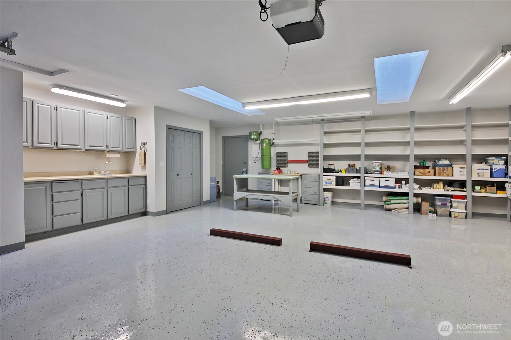 8111 Possession Ridge Lane Clinton, WA 98236 - Photo 32 of 37 a living room with lots of furniture and clutter