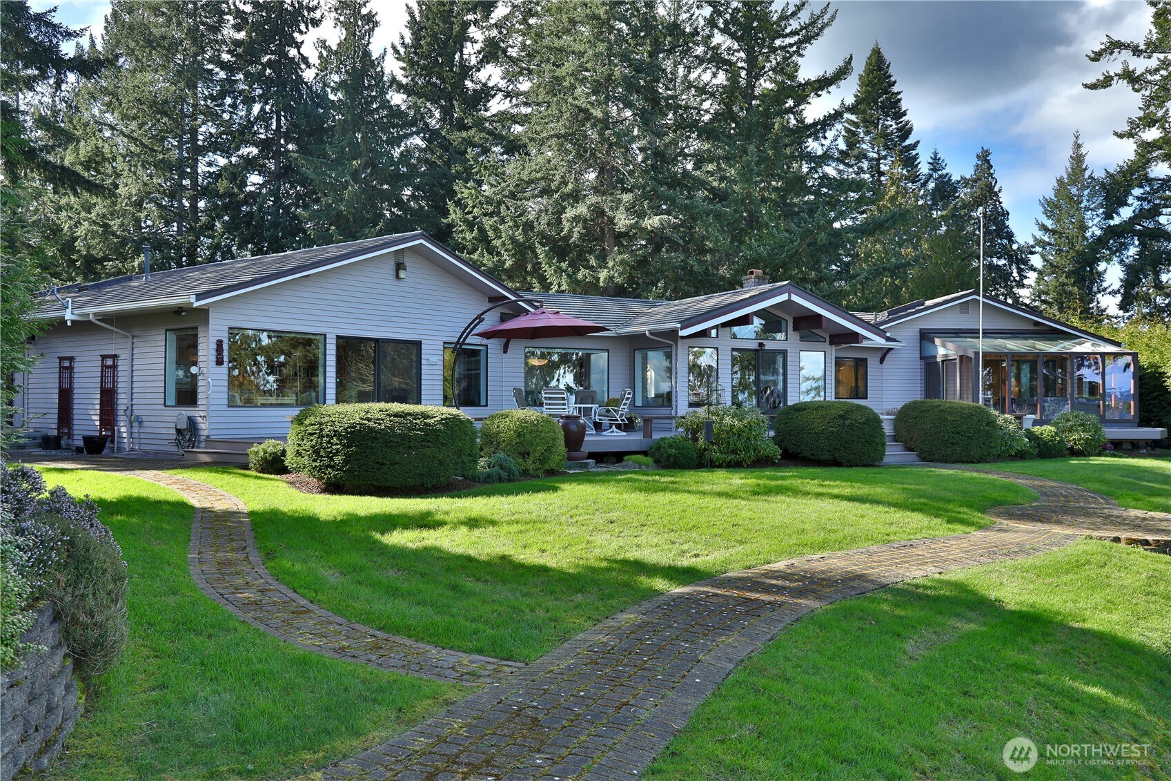 8111 Possession Ridge Lane Clinton, WA 98236 - Photo 5 of 37 a front view of a house with a yard and porch
