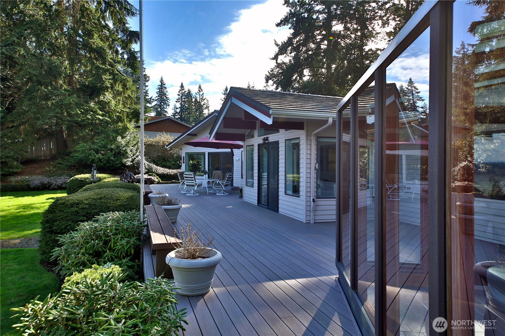 8111 Possession Ridge Lane Clinton, WA 98236 - Photo 8 of 37 a patio with hardwood table and chairs